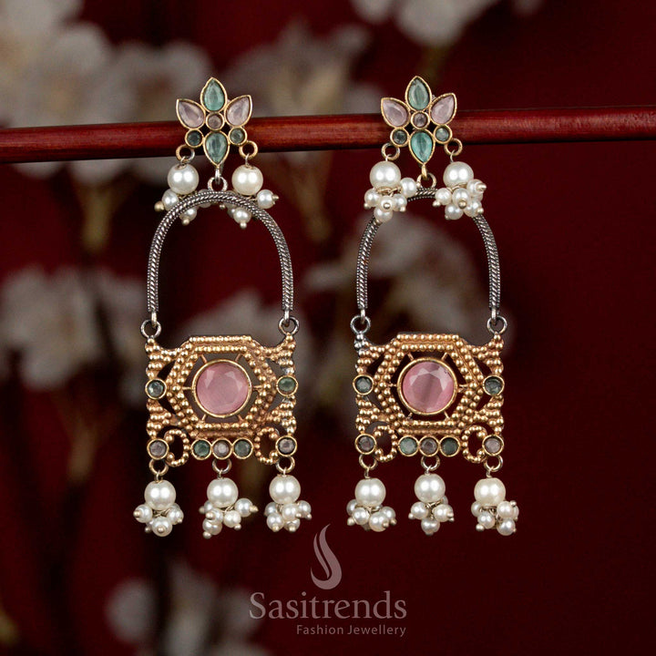 Artistic antique oxidised silver earrings featuring pink-mint Monalisa stones, sculpted floral arch motifs and delicate pearl cluster drops for festive cultural wear - Sasitrends