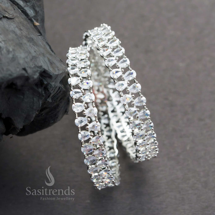Elegant Rhodium Silver Plated Bangles For Party Wear With White American Diamonds And Tear Drop Accents Jewellery - Sasitrends
