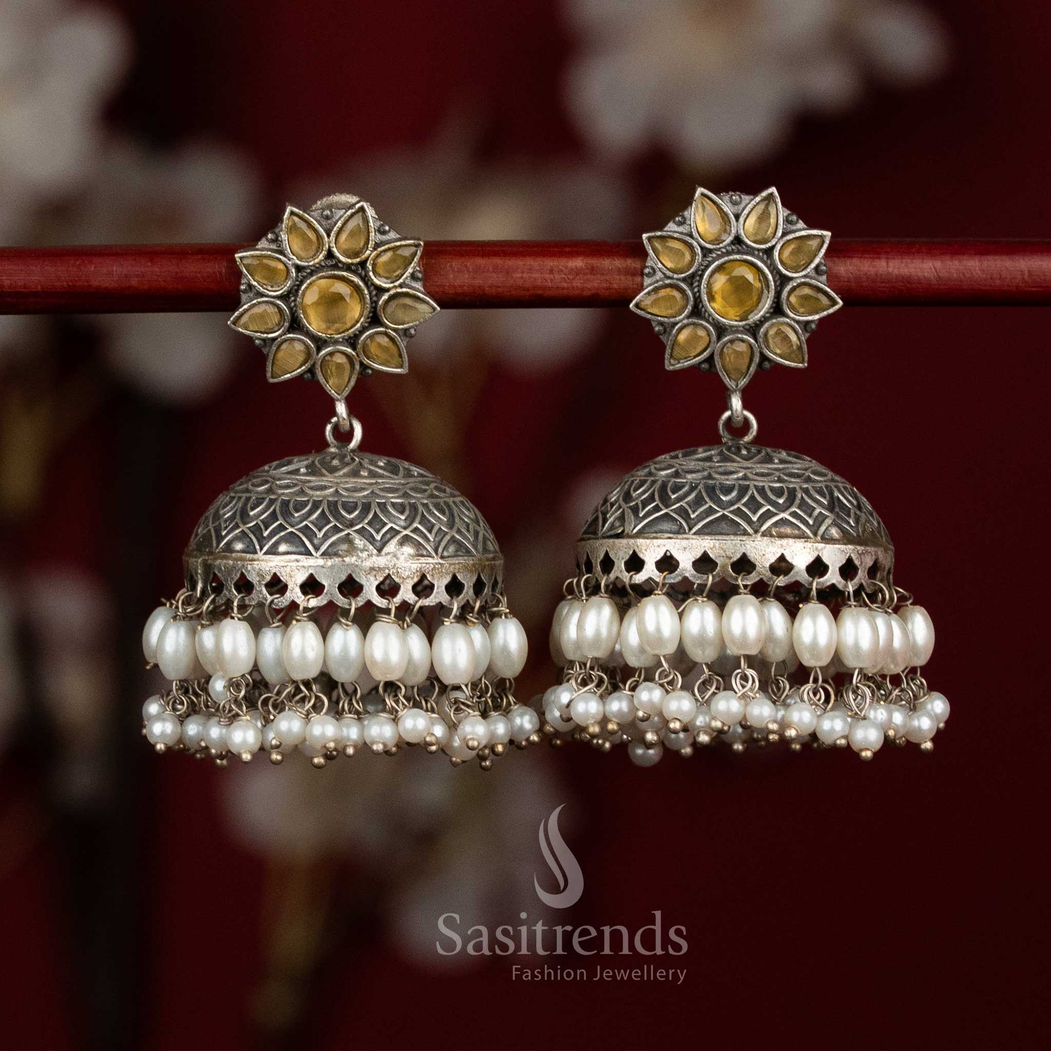 Golden heritage oxidised 92.5 silver yellow dome jhumkas with floral stone accents and layered pearls for festive luxury - jewellery - Sasitrends