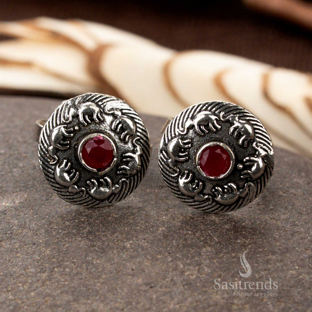 Oxidised silver floral band toe ring with adjustable fit and vintage texture, featuring delicate petal motifs and traditional foot glamour with ethnic ornamentation by Sasitrends