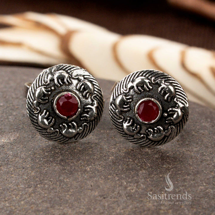 Oxidised silver floral band toe ring with adjustable fit and vintage texture, featuring delicate petal motifs and traditional foot glamour with ethnic ornamentation by Sasitrends