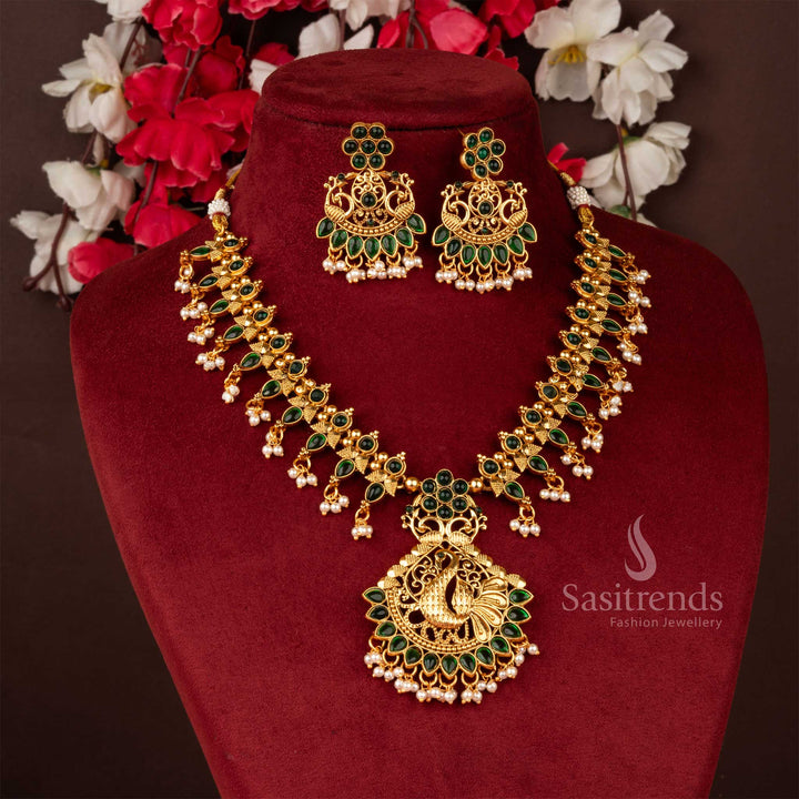 Elegant green matte gold necklace with peacock floral pendant, a designer jewellery set perfect for wedding and festive occasions - Sasitrends