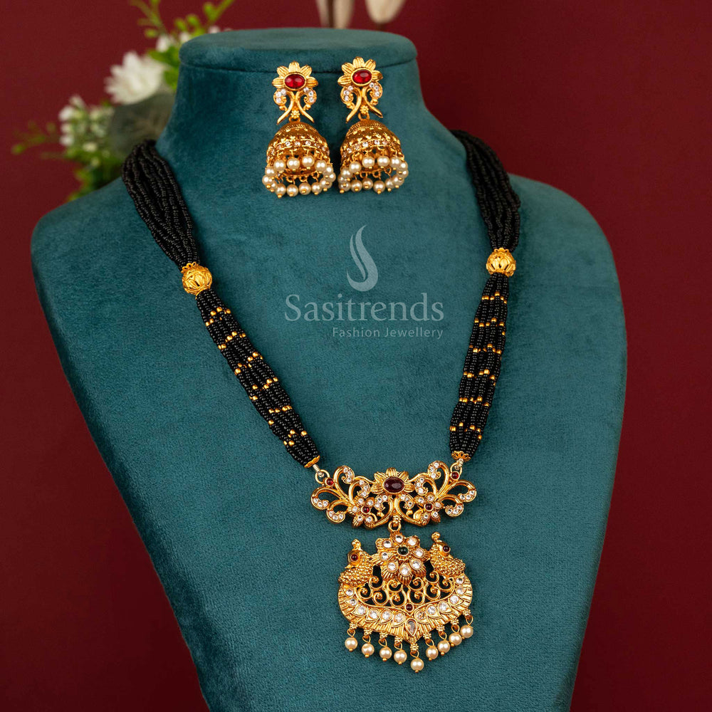 Traditional matte gold necklace on black beaded thread with a richly coloured peacock pendant, blending cultural elegance with a graceful finish – Sasitrends