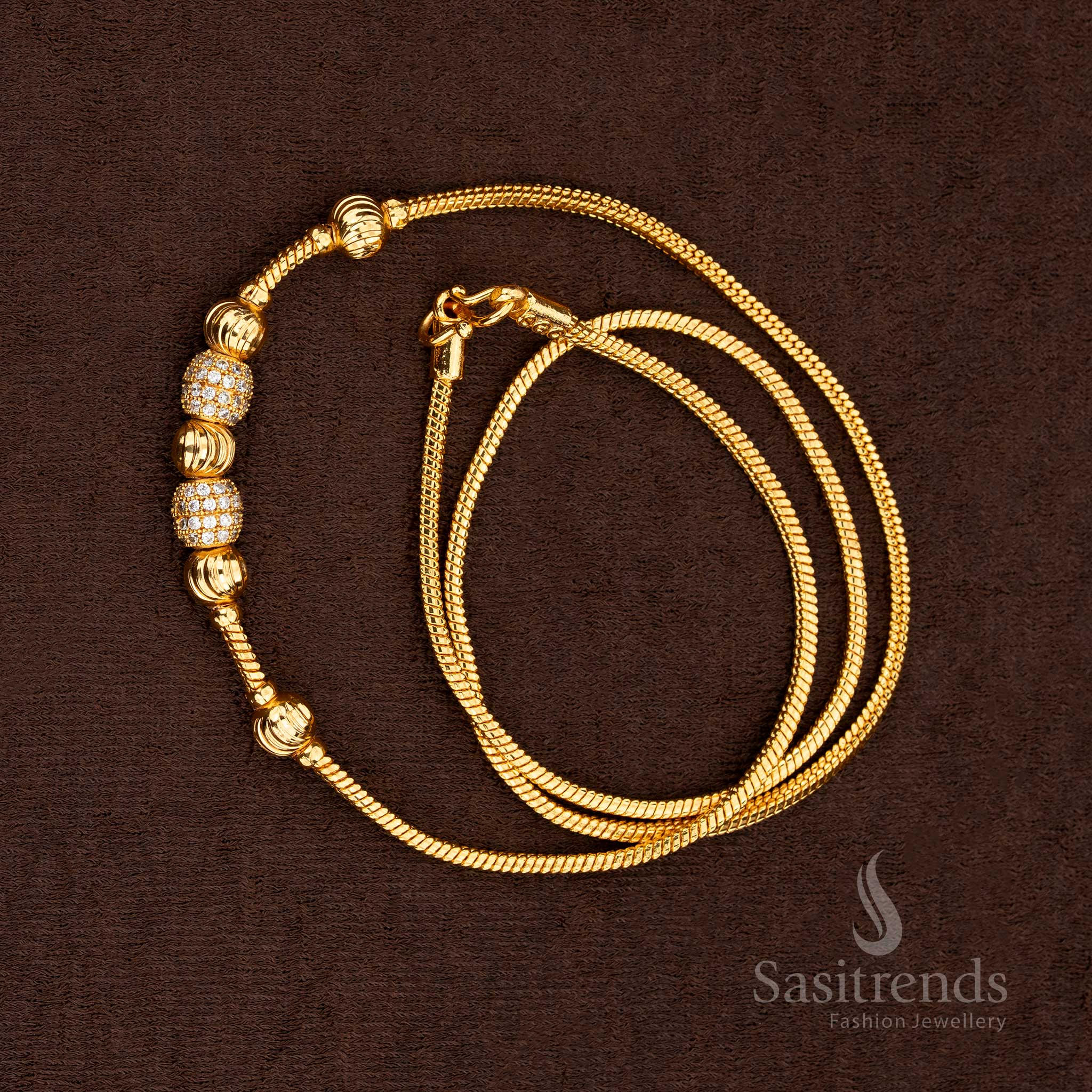 Lustrous white gems set along a polished gold chain featuring golden bead highlights for a sophisticated look – Sasitrends