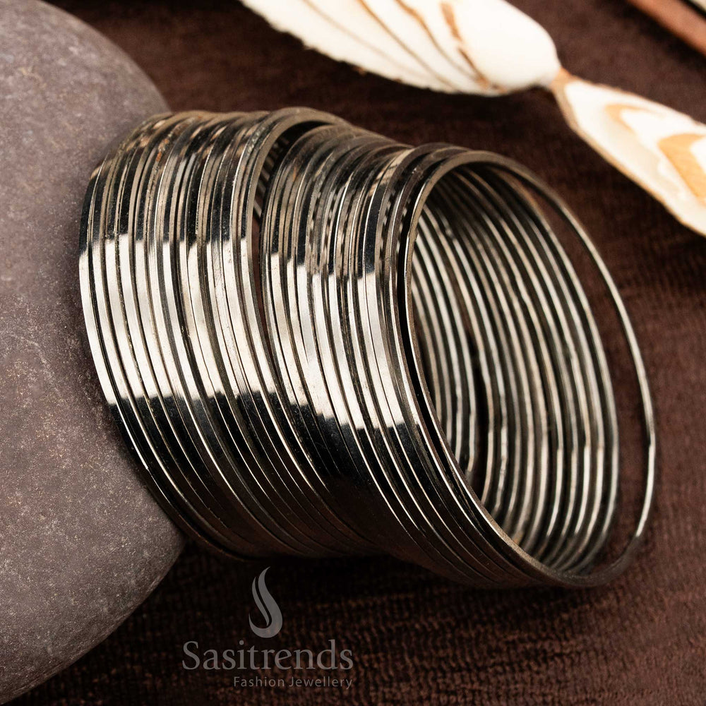 Bold oxidised black metal bangles set with a traditional minimalist design, ideal for everyday wear, casual outings, and versatile ethnic jewellery styling by Sasitrends