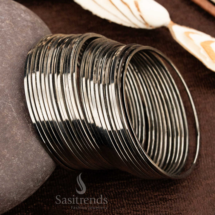 Bold oxidised black metal bangles set with a traditional minimalist design, ideal for everyday wear, casual outings, and versatile ethnic jewellery styling by Sasitrends