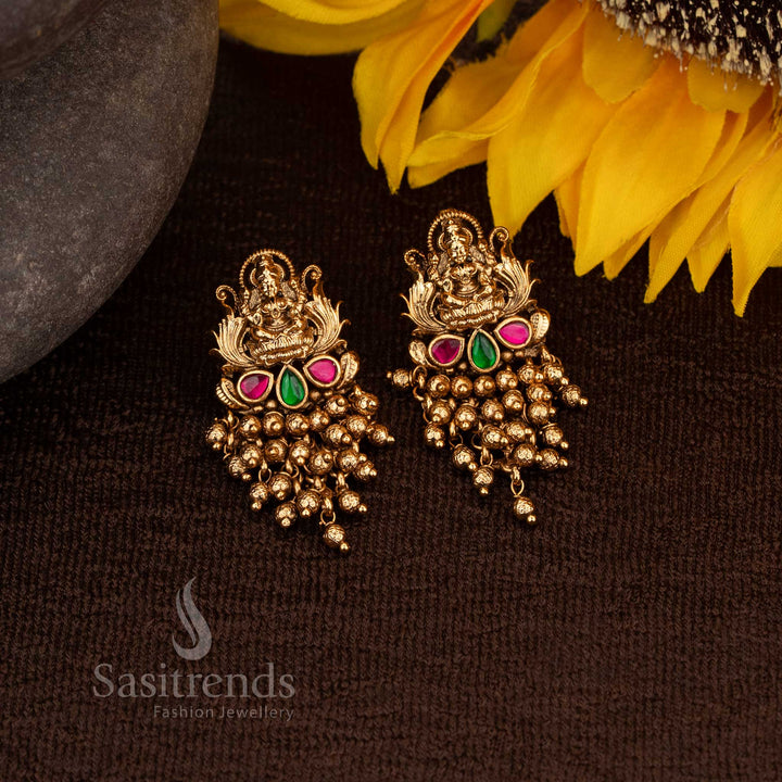 Elegant Matte Gold Lakshmi Design Temple Earrings with Ruby-Green AD Stones and Gold Bead Drops – Sasitrends