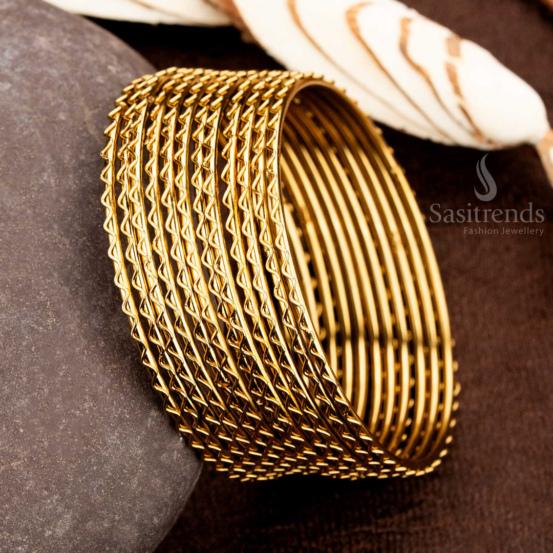 Heritage-style gold-polished textured bangles with dual-shade glow and luxurious ethnic elegance, designed to complement traditional wedding wear and festive jewellery ensembles by Sasitrends