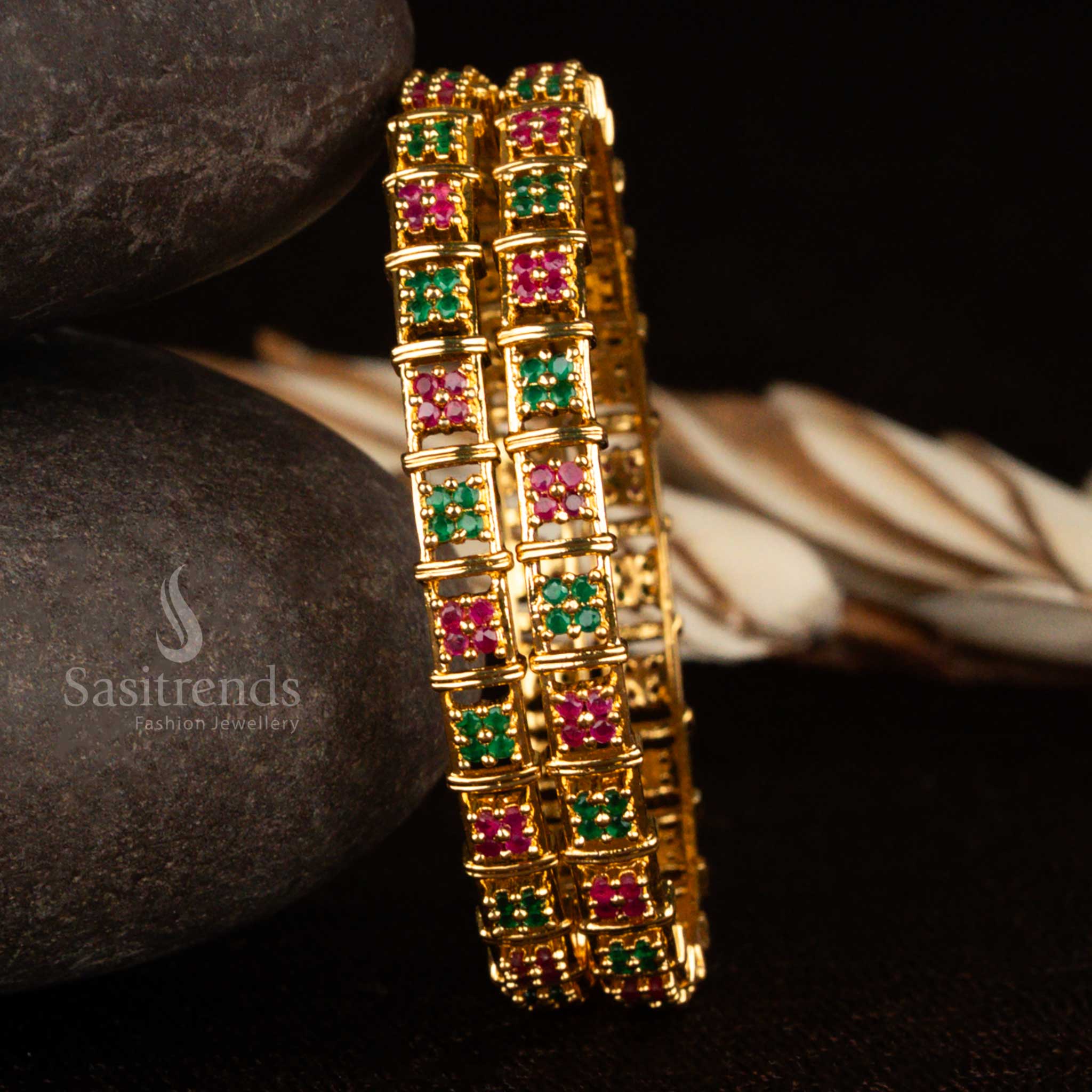Ruby-green floral motif traditional micro gold plated bangles pair with American diamond detailing – a rich ethnic jewellery choice radiating festive glamour and timeless beauty by Sasitrends