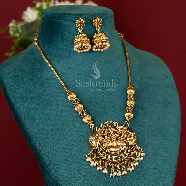 Ethnic temple-style jewellery set with soft green tones, a divine Lakshmi motif pendant and textured jhumka earrings in antique matte gold – Sasitrends