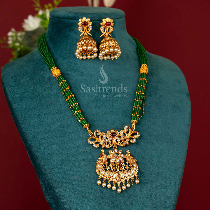 Handcrafted necklace with forest green stones and temple peacock pendant in a matte antique gold texture – made for cultural occasions and timeless looks – Sasitrends