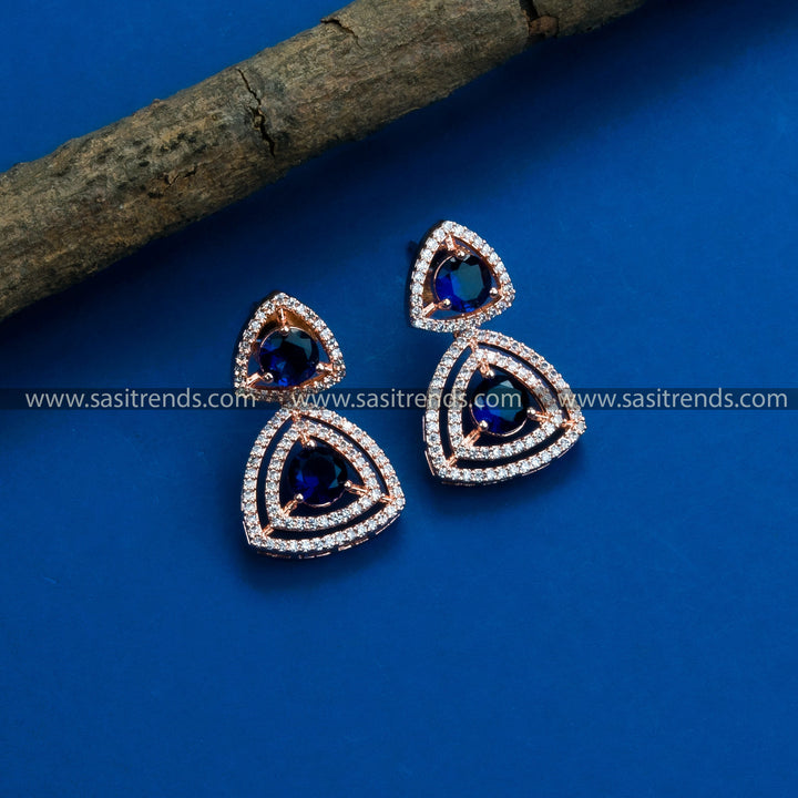 Latest party wear rose gold earrings adorned with a stunning floral pattern, American Diamonds, and elegant blue stones