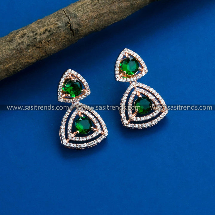 Trendy party wear rose gold earrings featuring an enchanting floral design, highlighted by American Diamonds and gorgeous green stones