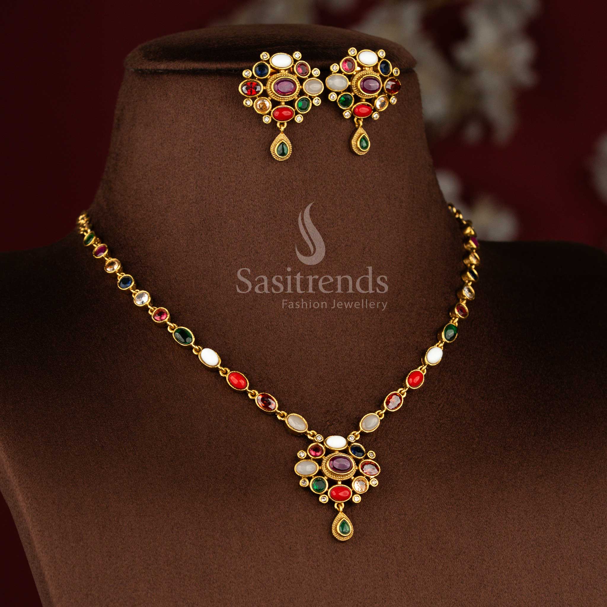 Temple style matte gold plated jewellery set highlighted with vibrant Navarathna stones and decorative floral pendant motif – Sasitrends