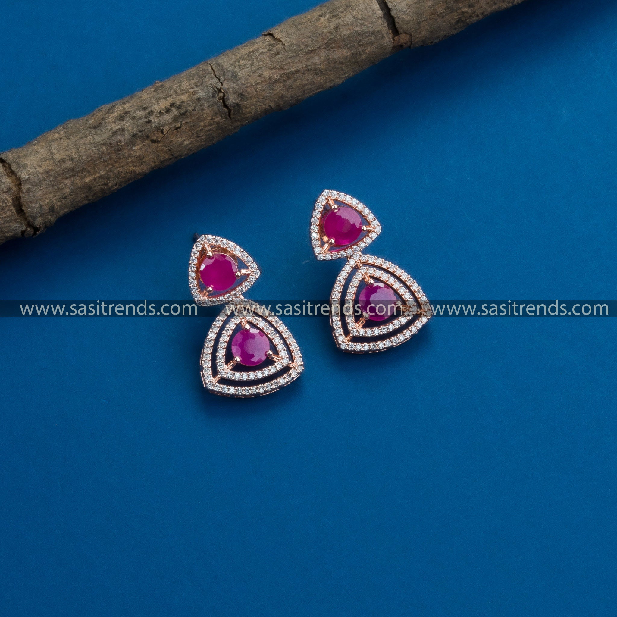 Latest party wear rose gold earrings, enhanced by American Diamonds and eye-catching ruby stones