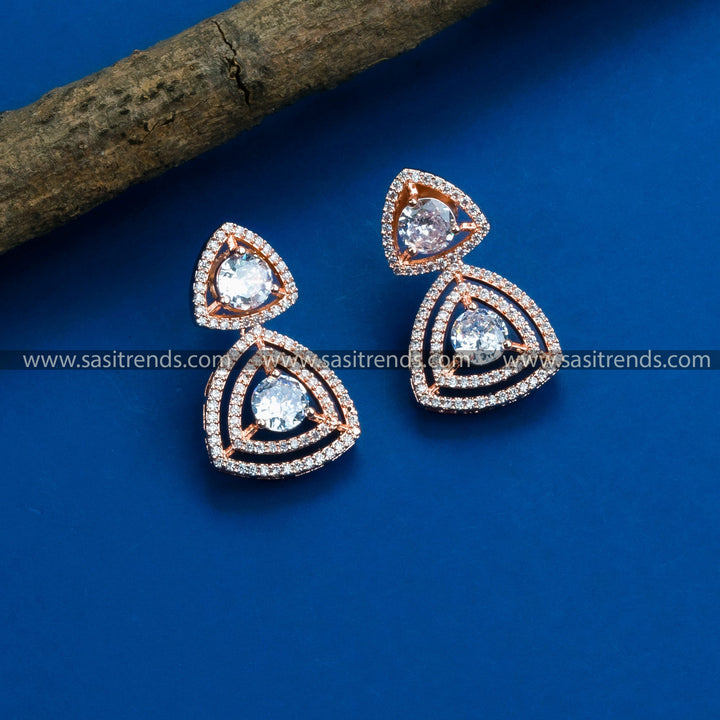 Glamorous rose gold plated earrings adorned with a floral motif, American Diamonds, and striking white stones