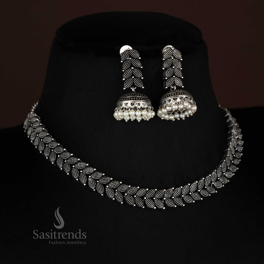 Stylish and classic black oxidised silver leaf motif necklace matched with traditional pearl jhumkas, a statement jewellery set for festive and party occasions – Sasitrends