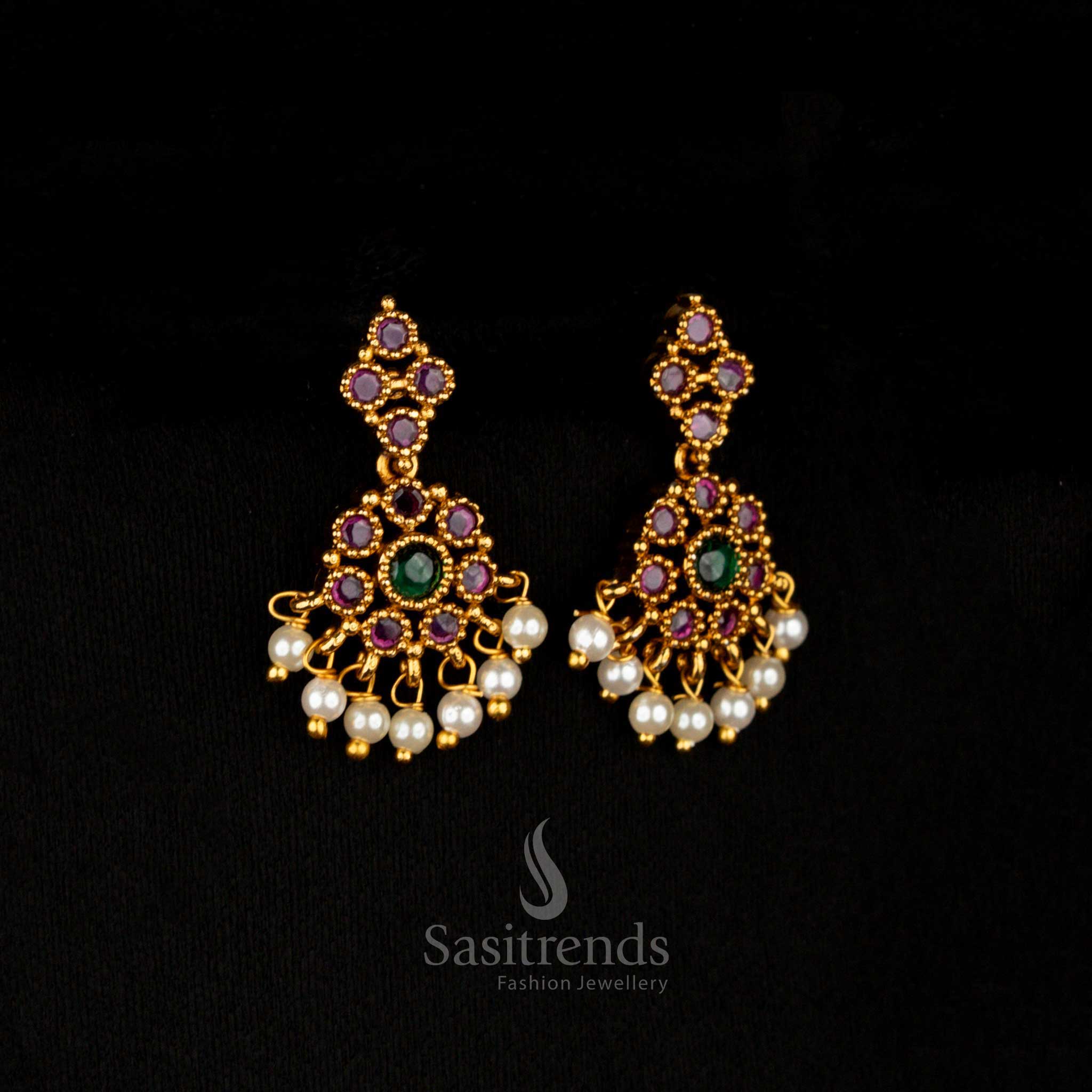 Fusion glow matte gold AD dual-tone earrings featuring ruby and green circular floral patterns in a dangle design, perfect for a traditional statement – Sasitrends