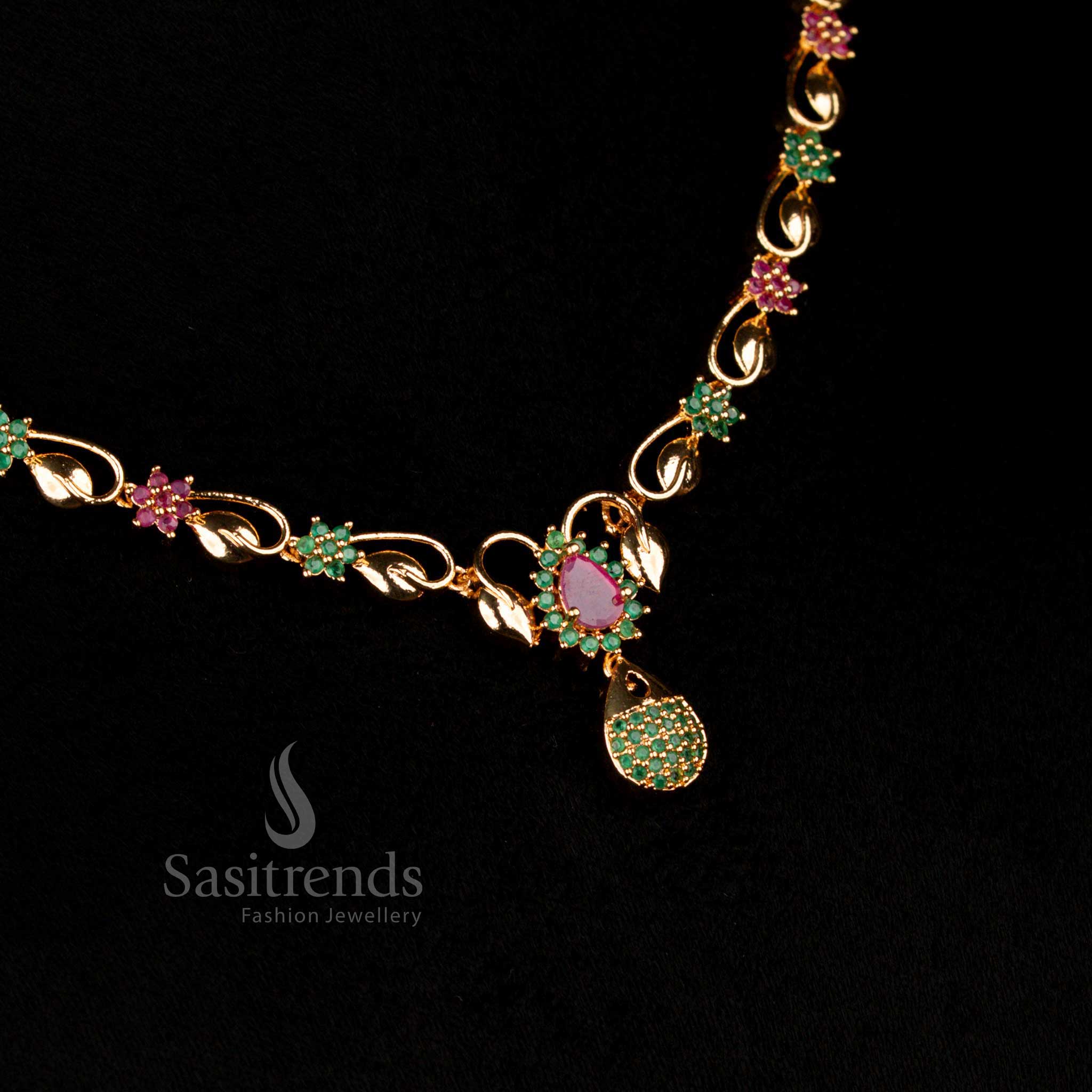 Fusion luxury micro gold AD teardrop pendant necklace featuring dual-tone ruby and green stones, ideal for traditional bridal jewellery and festive elegance – Sasitrends