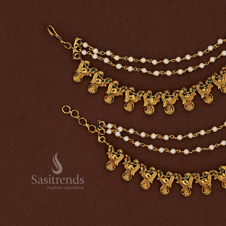 Regal Lakshmi motif temple matte gold plated American diamond matil ear chains adorned with vibrant green stones and classic pearl embellishments for ceremonial wedding wear - Sasitrends