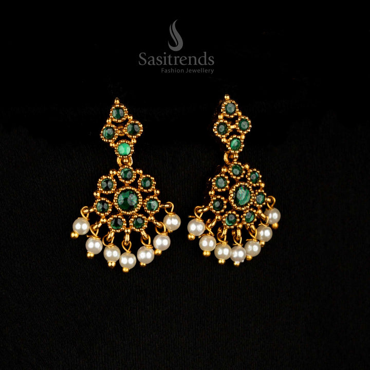 Emerald lush matte gold AD floral dangle earrings, featuring green circular patterns and artisanal elegance for statement traditional jewellery – Sasitrends