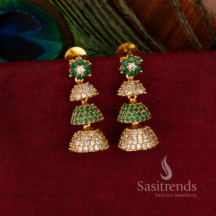 Ornate Gold Plated Brass Triple-Layer Jhumkas with White-Green American Diamond Accents, Perfect Traditional Jewellery for Elegant Celebrations – Sasitrends