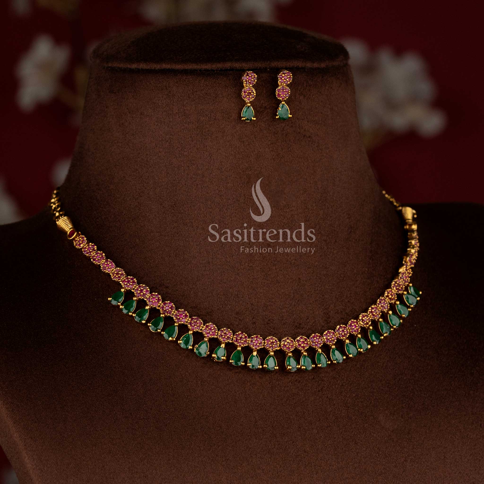 Opulent American diamond matte gold plated ruby-green teardrop necklace set with designer earrings for party and celebration-ready saree styling – Sasitrends