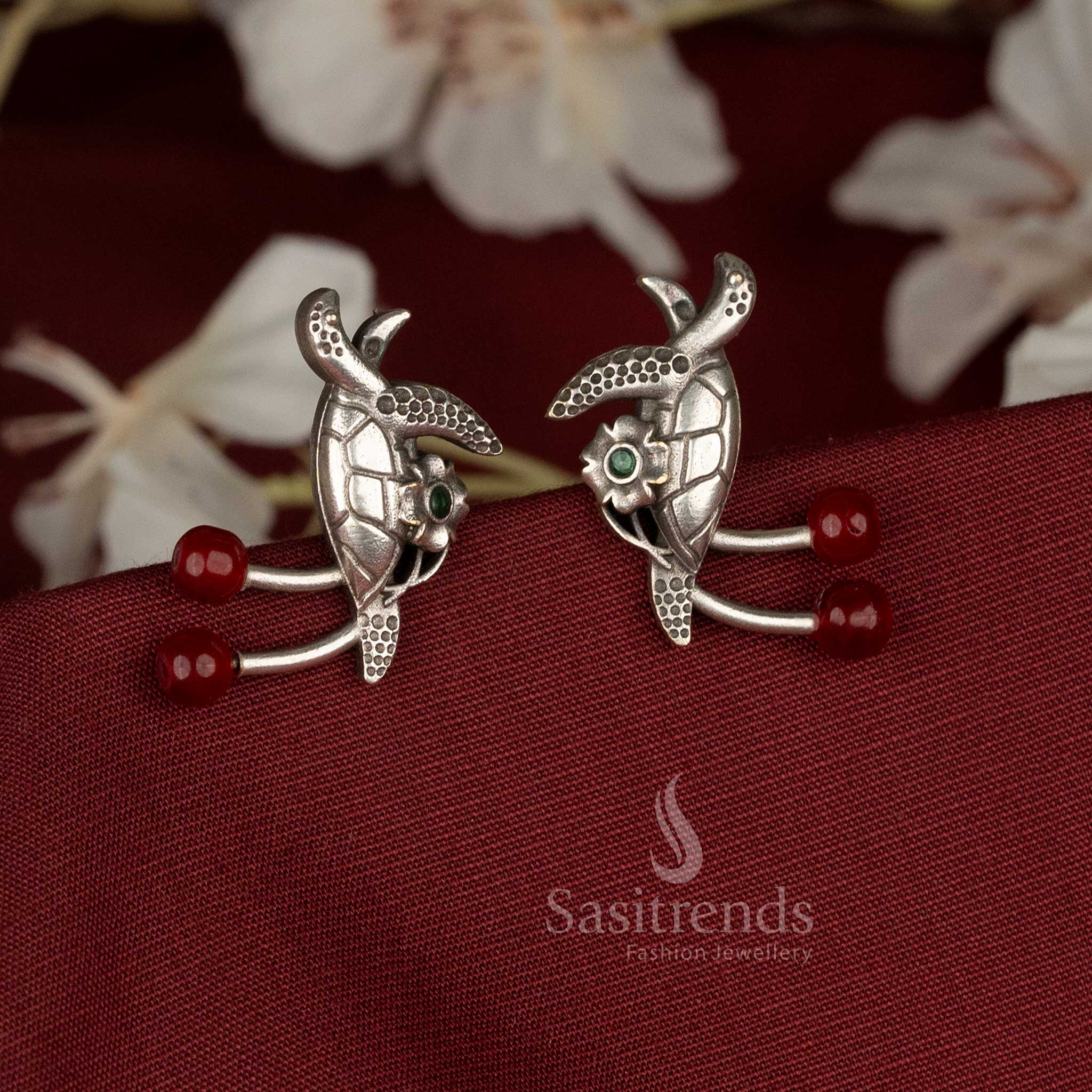 Radiant oxidised German silver turtle earrings adorned with red pearls and stones, suitable for festive, casual, and office wear – Sasitrends