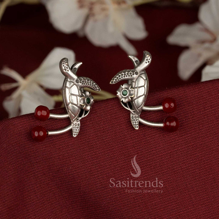 Radiant oxidised German silver turtle earrings adorned with red pearls and stones, suitable for festive, casual, and office wear – Sasitrends