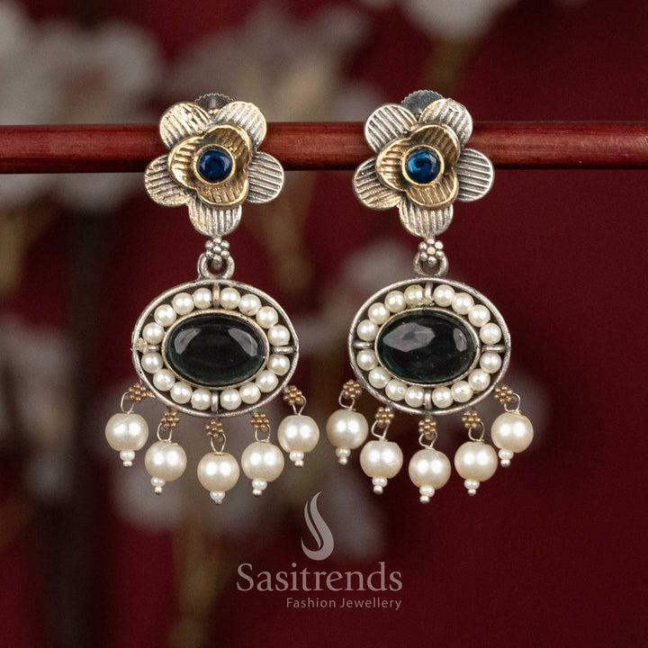 Elegant oxidised silver floral studs featuring blue-green Monalisa stones, intricate floral motifs and pearl cluster drops for festive ethnic wear - Sasitrends