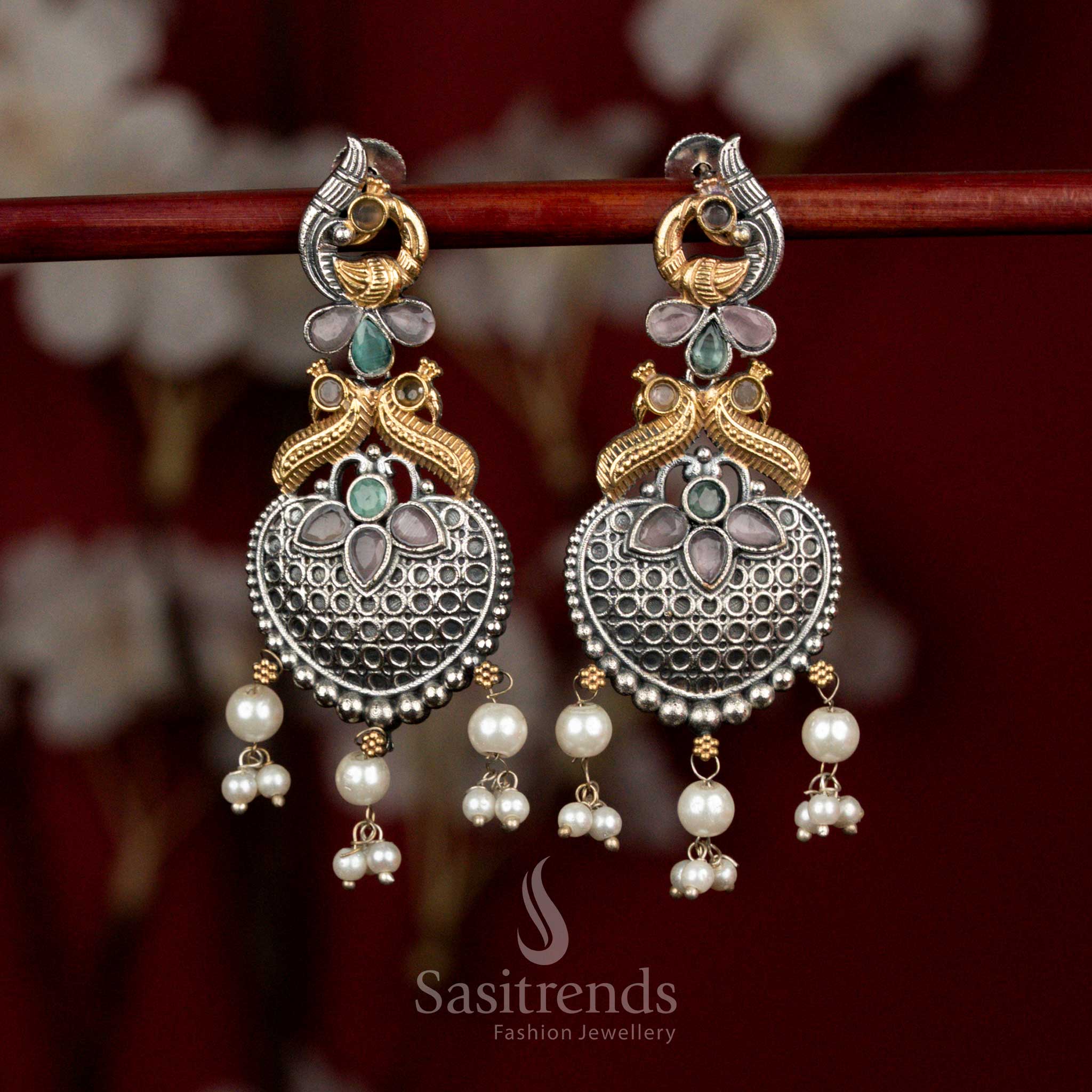 Heritage oxidised silver earrings featuring pink-mint Monalisa stones, artistic peacock heart design and pearl cluster drops for lively party styling - Sasitrends