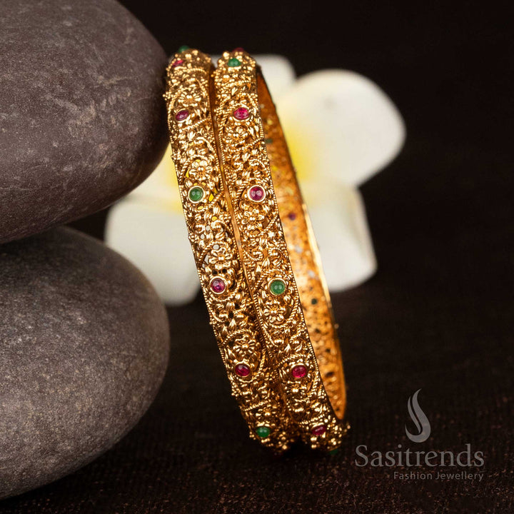 Luxurious ruby-green matte gold plated floral nakshi heritage bangle featuring round stones for celebratory elegance - Sasitrends