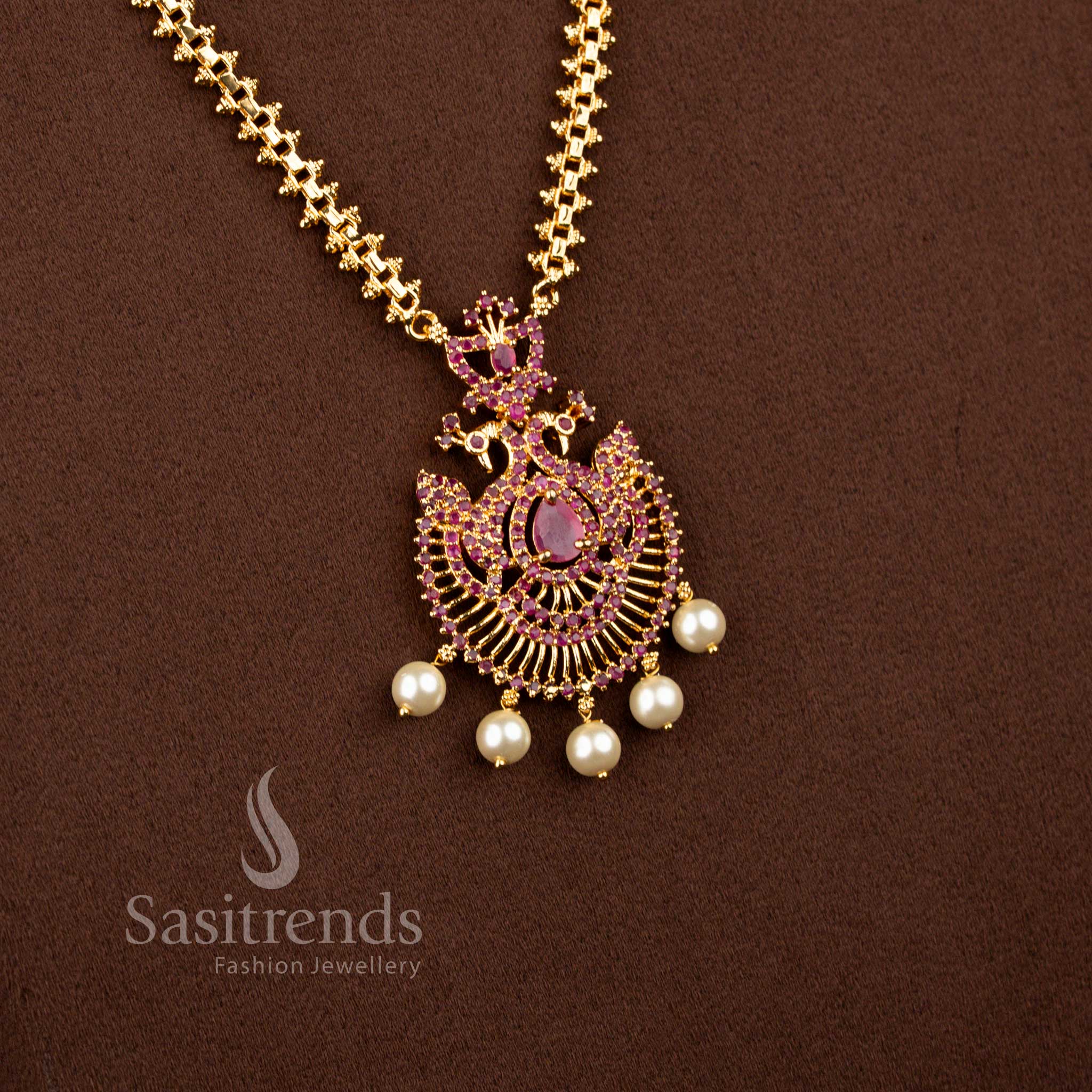 Majestic micro gold plated 2-side Gajiri chain necklace in ruby adorned with center pear stone peacock pendant and pearls – Sasitrends