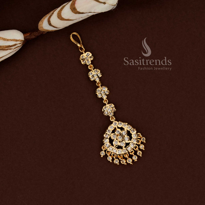 Vibrant white colour floral pattern Impon micro gold plated AD maang tikka designed for bridal fashion wedding functions festive outfits and ethnic celebration styling - Sasitrends