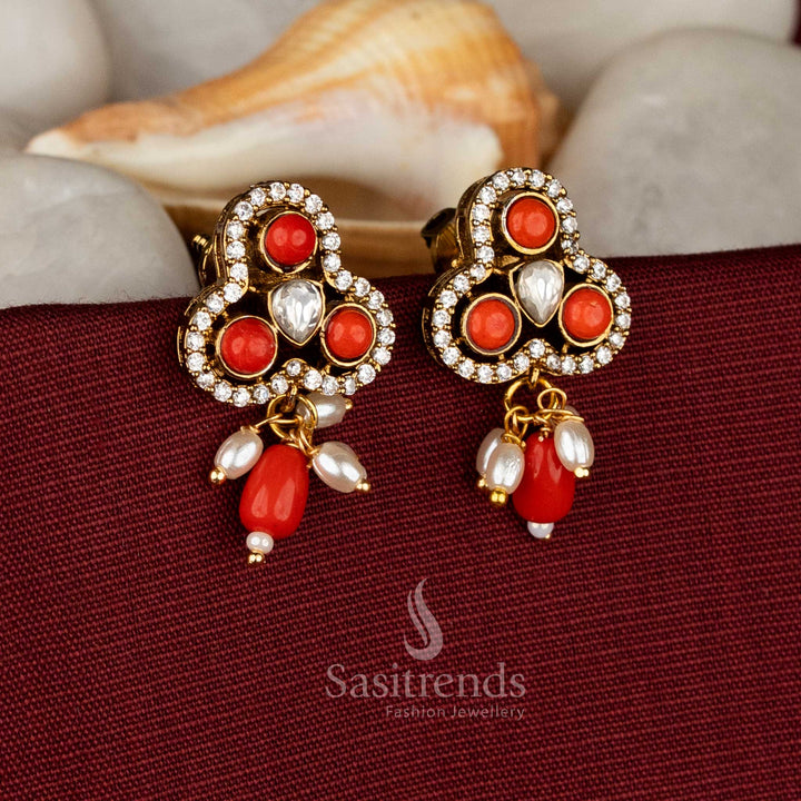 Tangerine regalia Victorian three-lobed stud earrings featuring rich coral AD stones and floating pearl drops for festive charm – Sasitrends