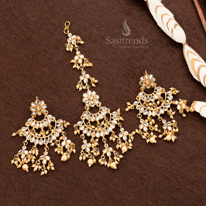 Classic antique gold plated tikka and earrings set featuring elegant white stone detailing, an intricate floral motif, and soft pearl clusters, exuding refined bridal charm - Sasitrends