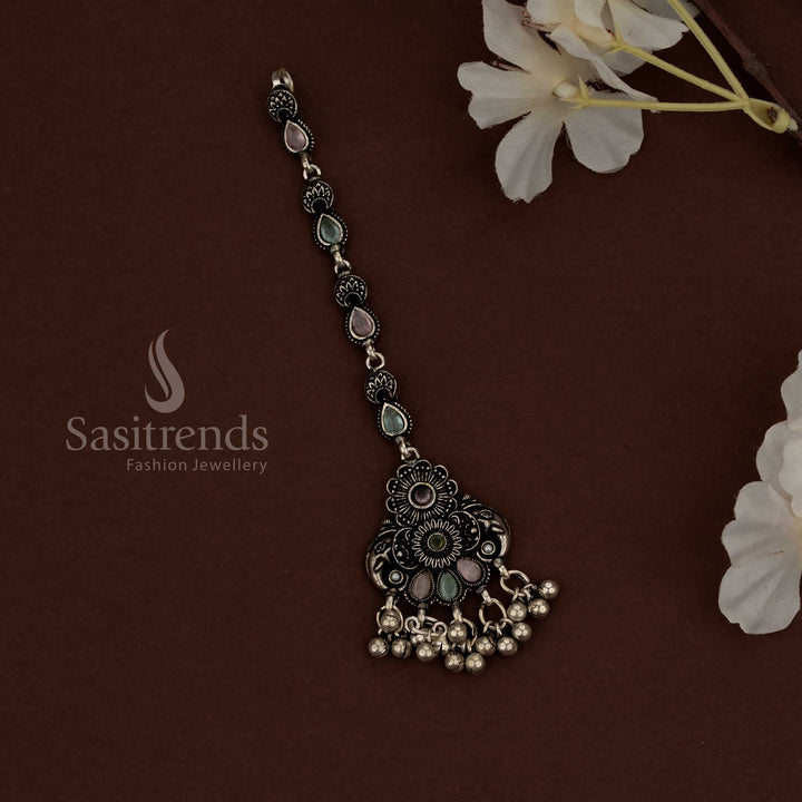 Authentic Kolapuri oxidised maang tikka with rustic tribal essence for traditional Navaratri wear - Sasitrends