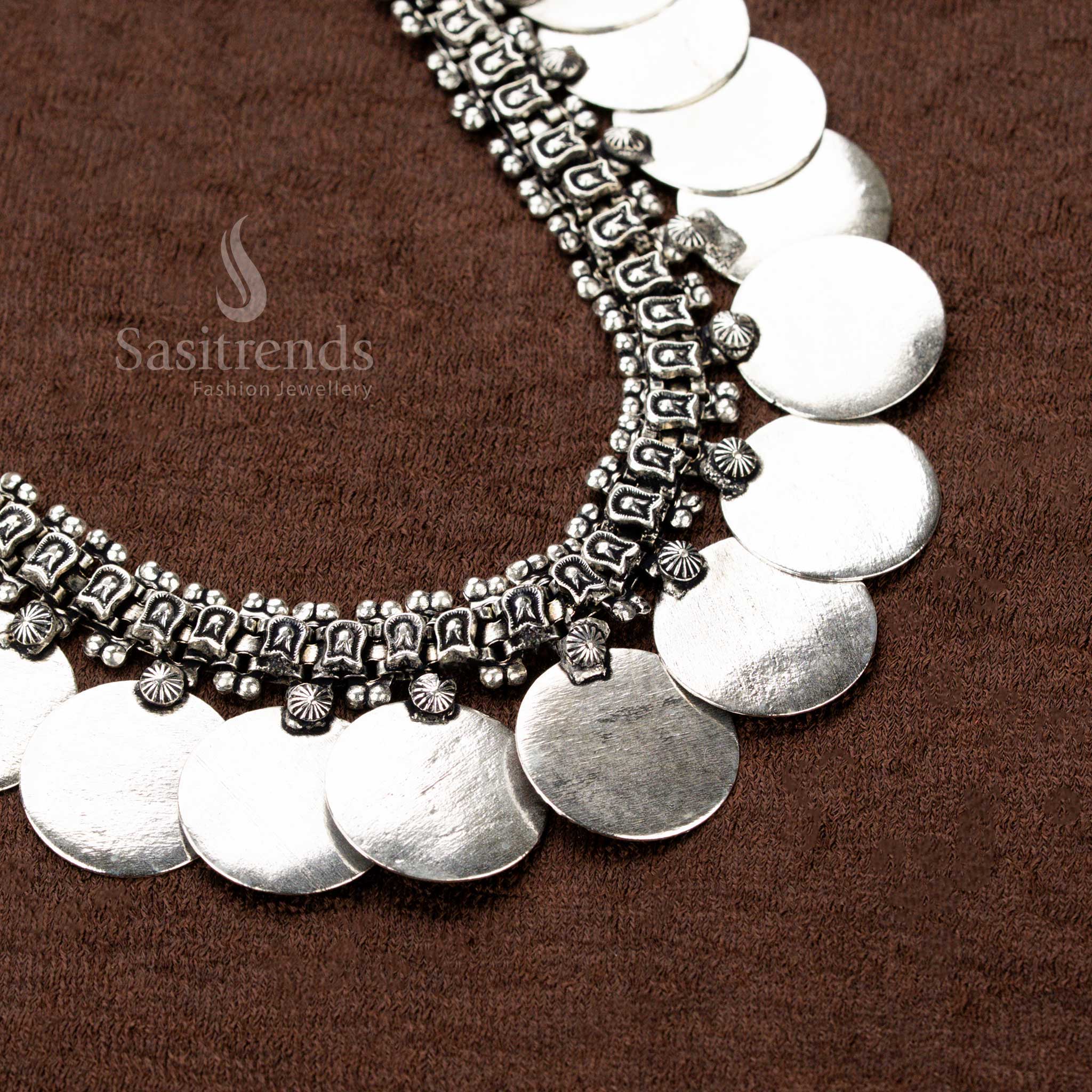Regal oxidised silver floral motif choker necklace set designed with raised dome medallions, antique ballwork, and artistic detailing, a must-have jewellery piece for Navaratri - Sasitrends