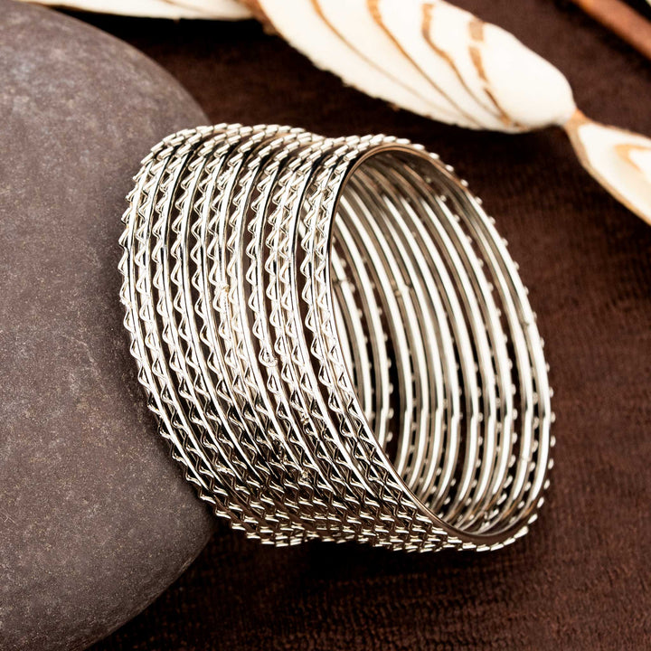 Artisanal antique-look oxidised bangles set of four, adorned with classic textures and regal dual-toned beauty, ideal for cultural occasions and heritage-rich traditional jewellery styling by Sasitrends