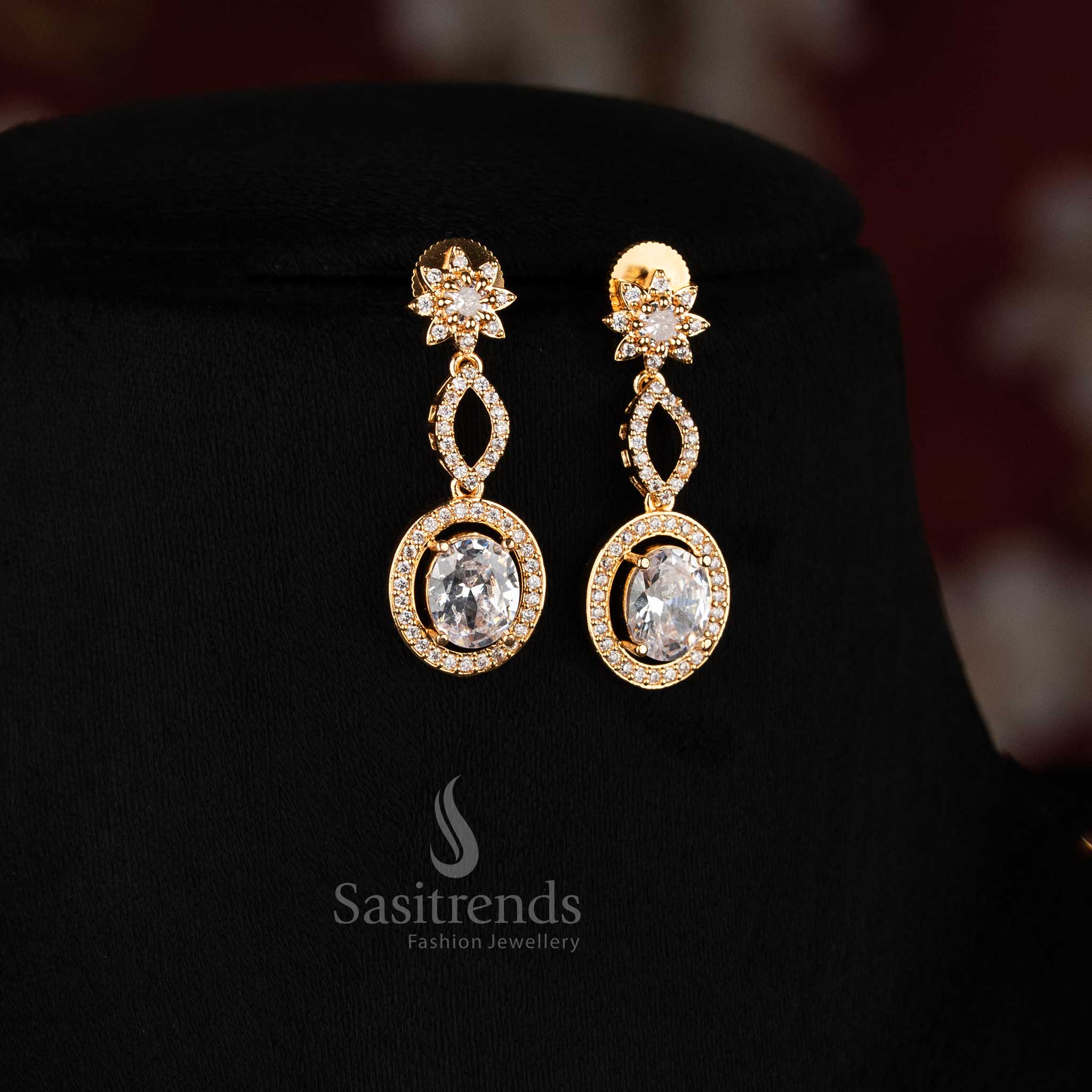 Exquisite white floral leaf American diamond micro gold plated earrings with oval details, beautiful festive jewellery giving a real gold appearance - Sasitrends