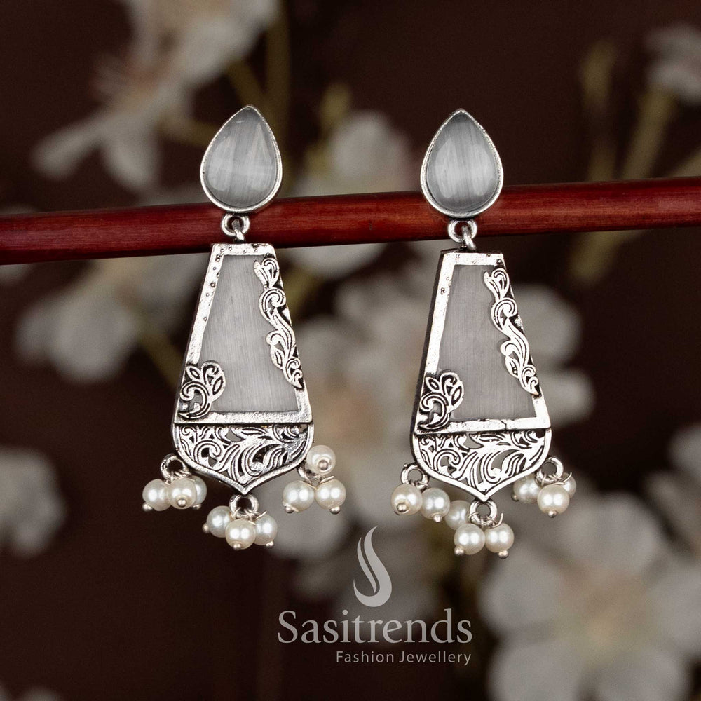 Elegant white oxidised trapezoid drop earrings with teardrop stud top, designed for ethnic celebrations, Navaratri fashion, and graceful saree ensembles by Sasitrends