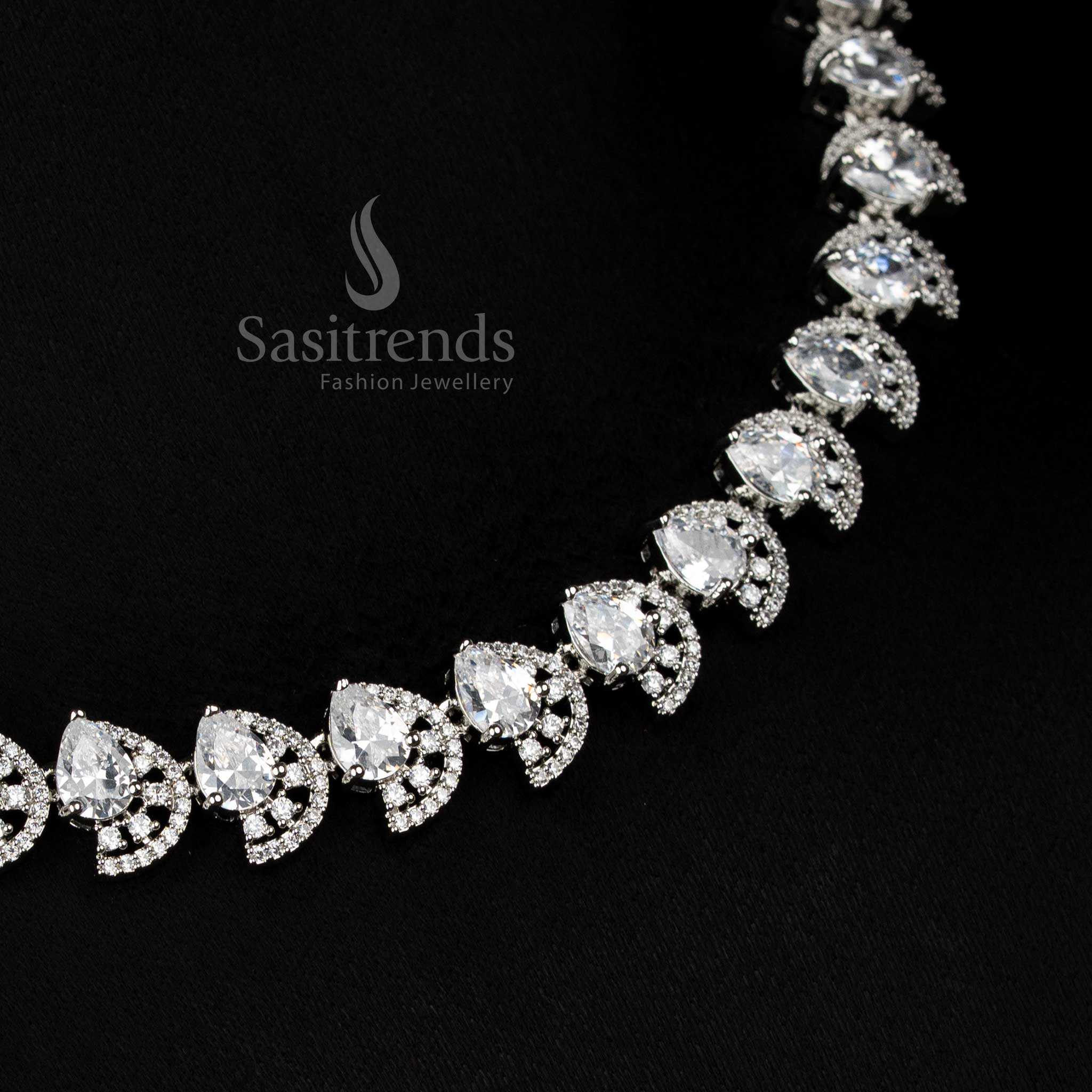 Elegant white rhodium silver infinity teardrop American diamond necklace set with dual finish for festive wear - Sasitrends