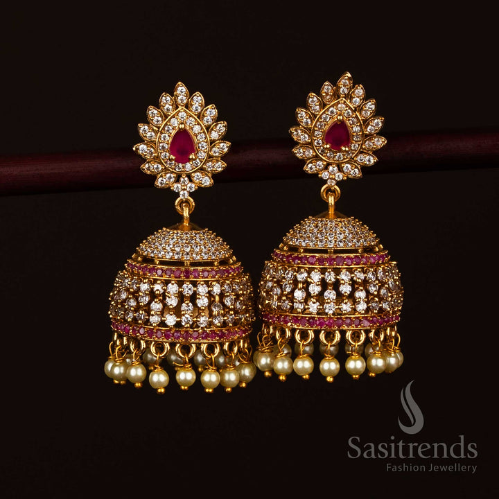 Sacred white ruby temple matte gold teardrop AD stone jhumka earrings ideal for rituals - Sasitrends