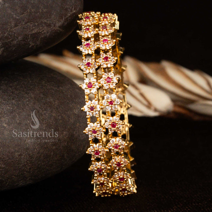Micro gold floral bangles embedded with white and ruby stones – a festive and elegant traditional jewellery accessory for wedding functions and puja wear by Sasitrends