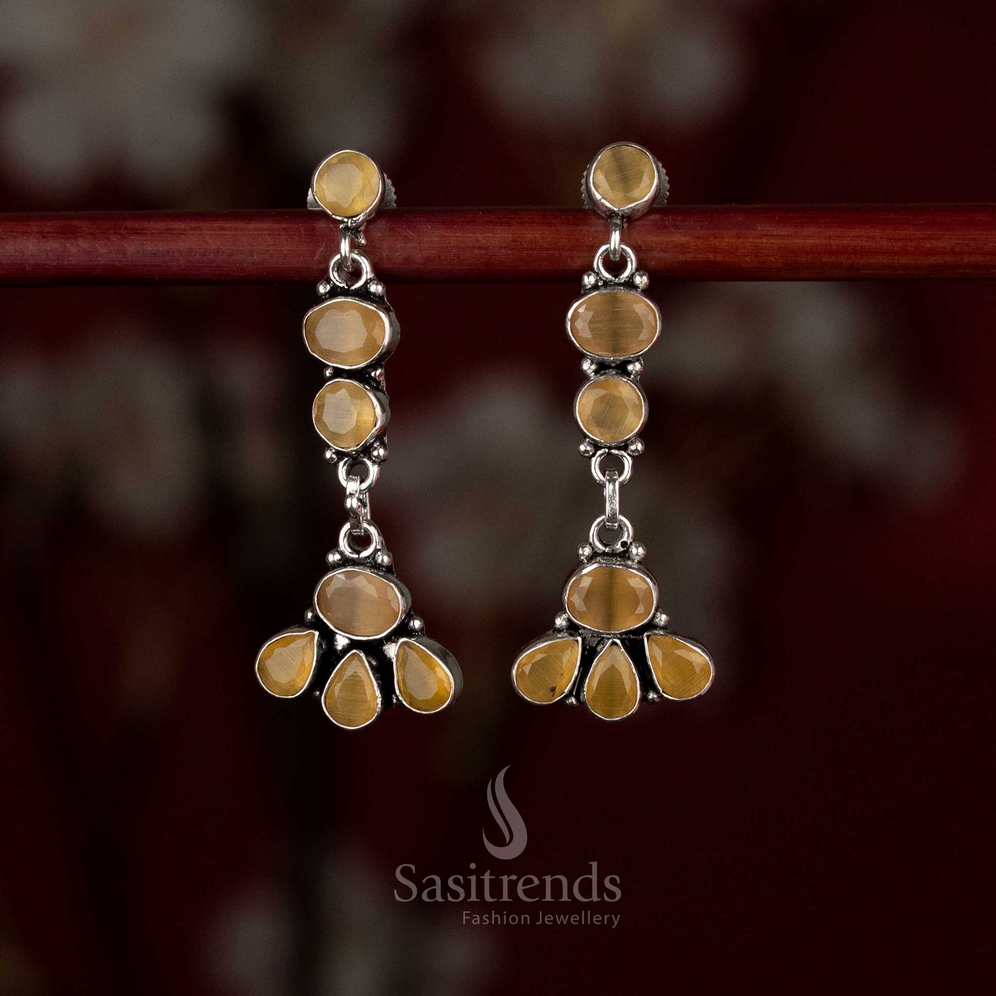 Yellow oxidised silver earrings with sunlit floral vertical elements forming an artistic drop – Sasitrends