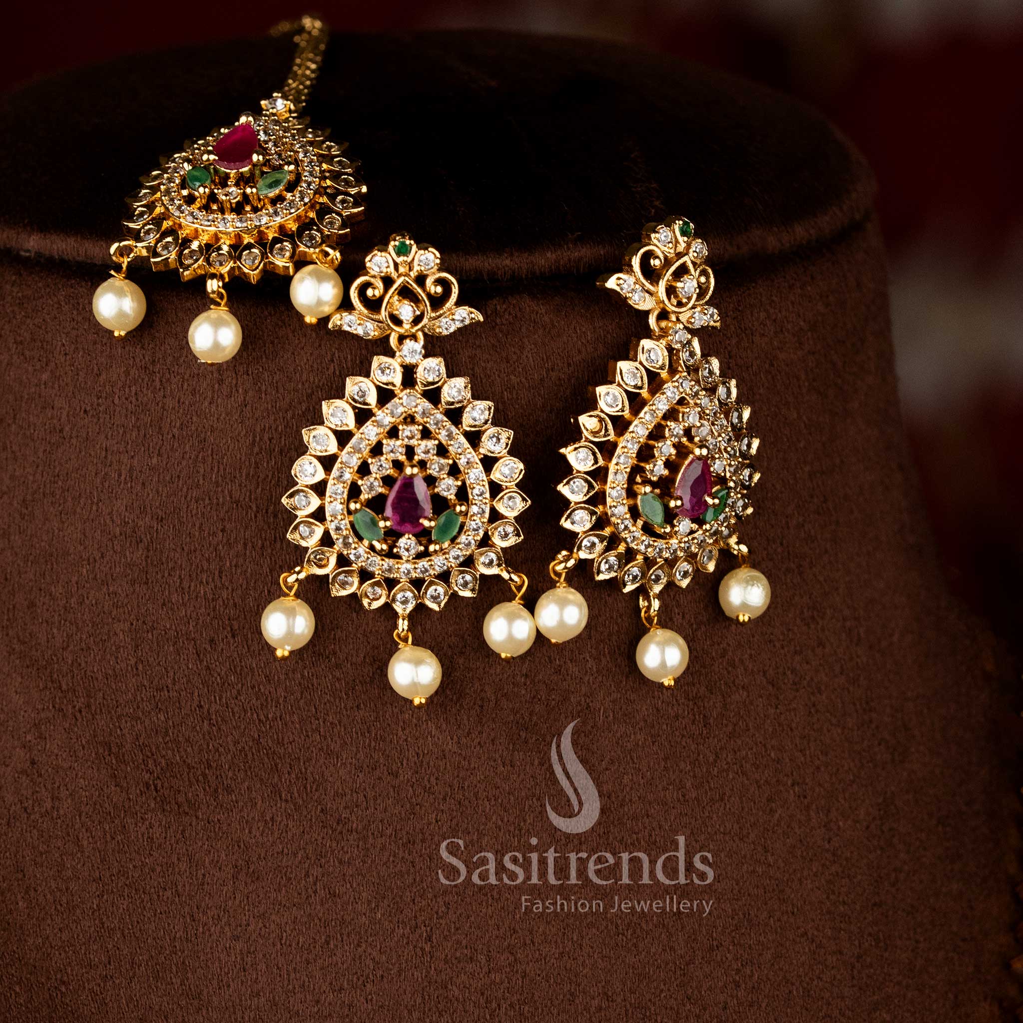 Elantra gleam matte gold finish earrings showcasing sparkling American diamonds arranged in elegant multi toned teardrop clusters – Sasitrends