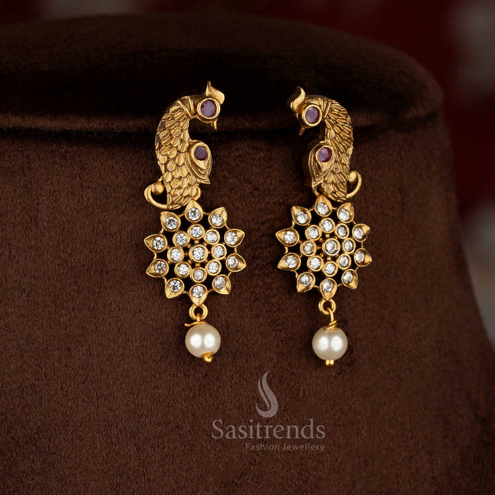 Charming American diamond matte gold plated white-ruby floral peacock earrings for celebration-ready saree dressing – Sasitrends