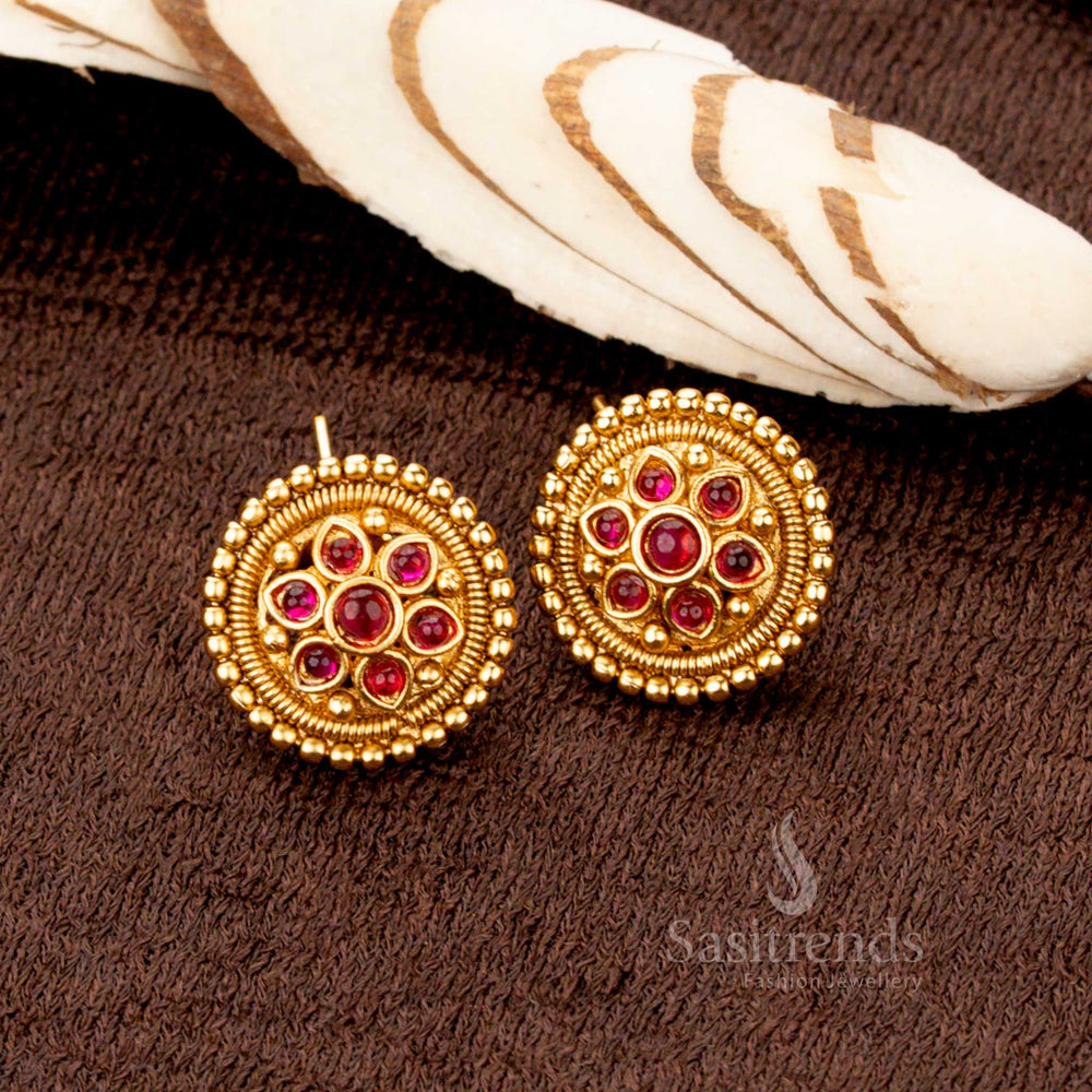 Stunning handcrafted antique gold earrings set with ruby stone floral motifs, an exquisite jewellery piece ideal for ceremonial events and festive occasions - Sasitrends