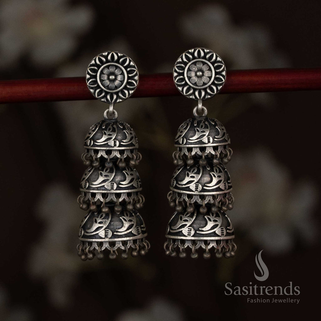 Celestique aura antique oxidised 92.5 silver plated floral coin stud paisley triple-tiered jhumka earrings - Sasitrends