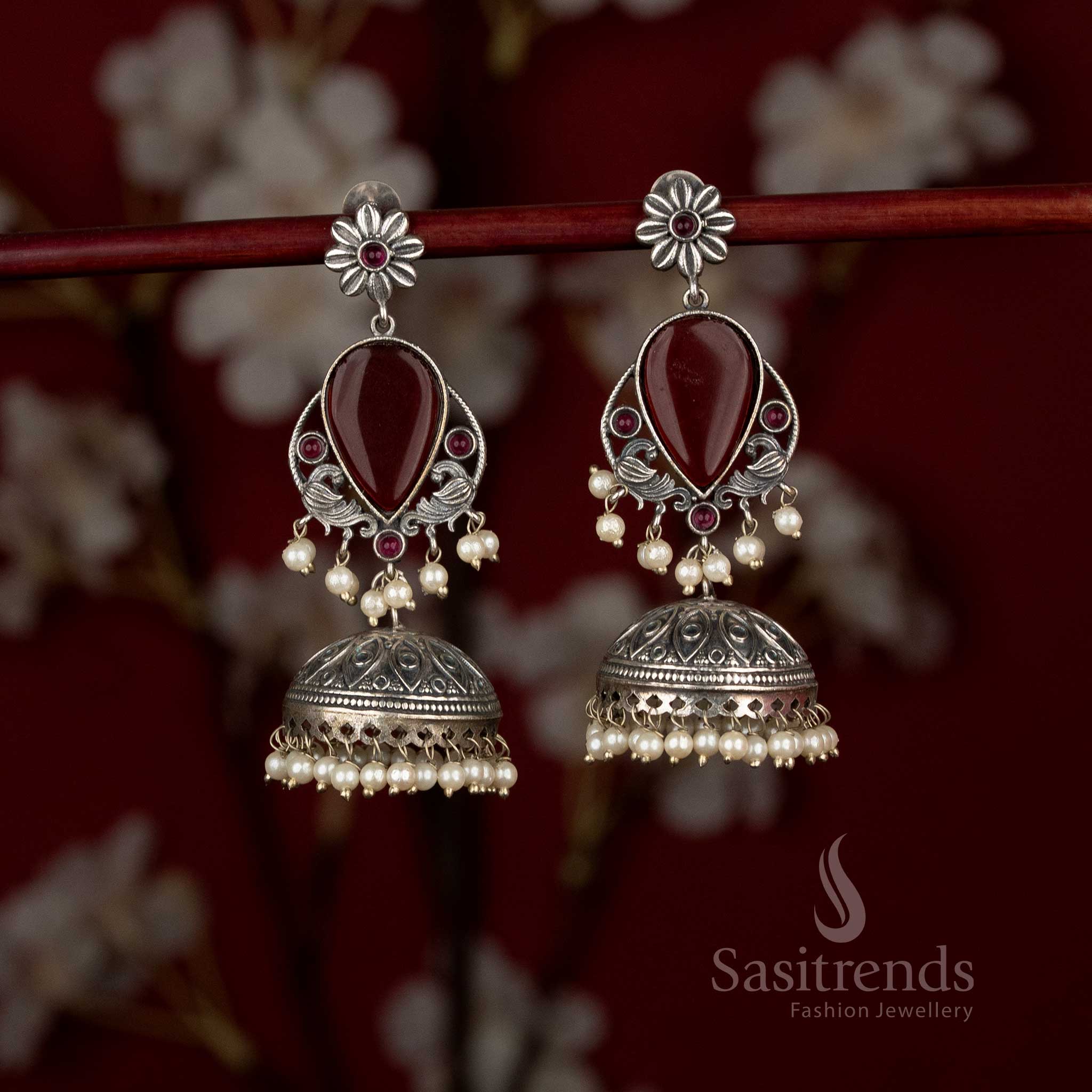 Antique oxidised peacock floral teardrop jhumkas with pearl detailing for modern ethnic wear - Sasitrends